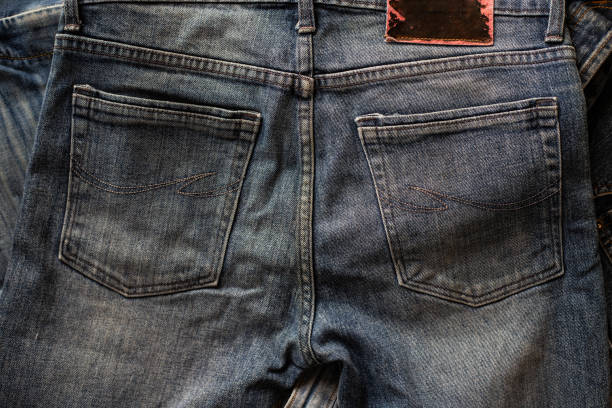 Top view of folded jeans,Blue jeans on a stack of jeans .