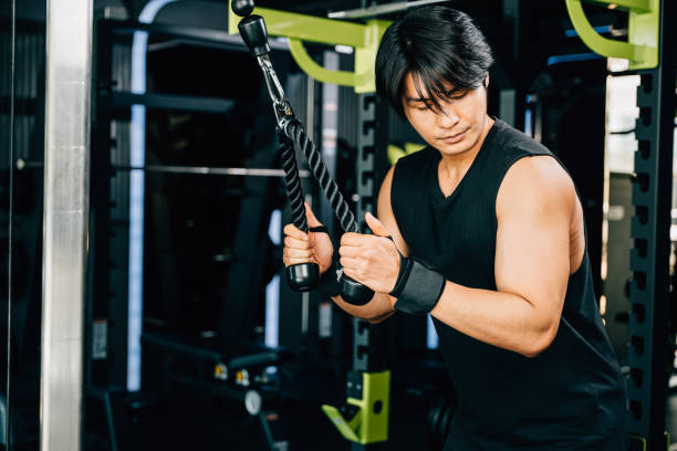 istock Young man performing cable triceps pulldowns to build muscle and strength 2185725260