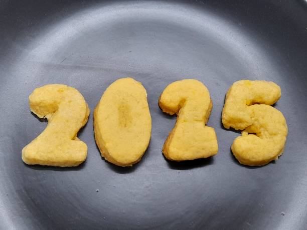 istock 2025 number from biscuit with dark background 2185733774