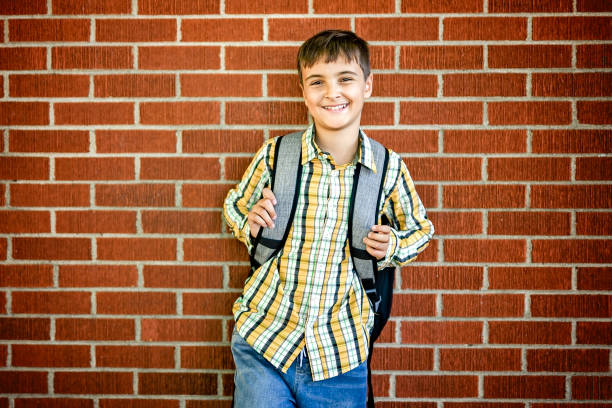 istock Student boy outside at school posing on autumn season 2185736180