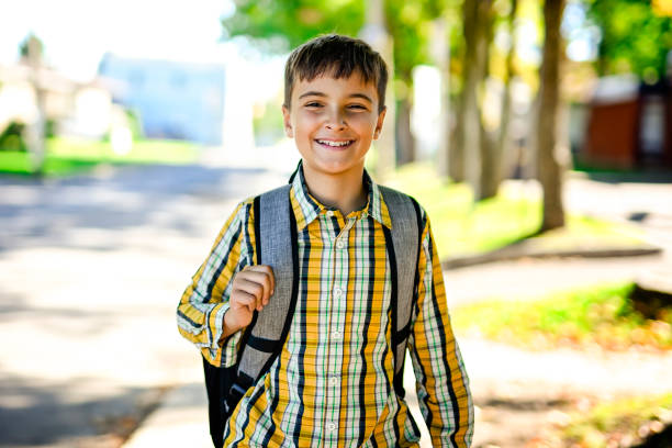 istock Student boy outside at school posing on autumn season 2185736185