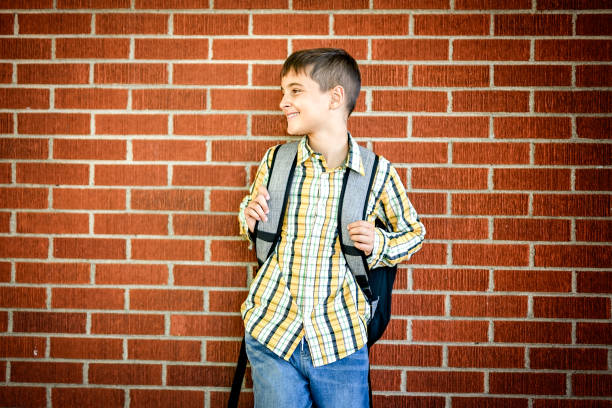 istock Student boy outside at school posing on autumn season 2185736192