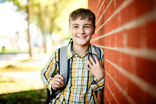 istock Student boy outside at school posing on autumn season 2185736211