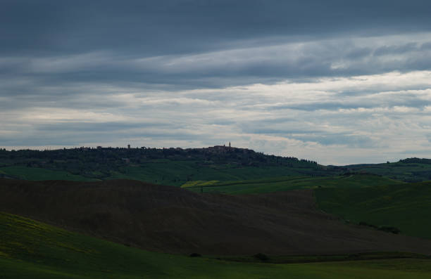 Tuscany fields in springtime, cloudy day mood, Val d'Orca, Pienza region
