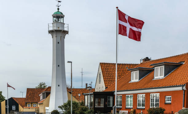 Lighthouse with the Danish flag in a small town Ronne, Bornholm, Denmark