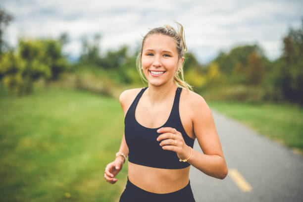 istock Front view of a happy runner teen doing jogging 2185749909
