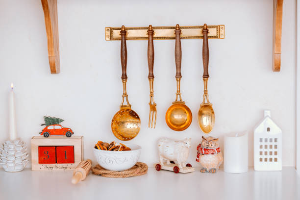 istock Decorative kitchen utensils hanging on a wall with charming accents 2185755476