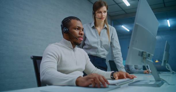 istock Team of technical support specialists working in online customer support 2185756346