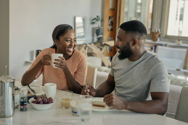 istock Young African American couple laughing together over breakfast 2185758122
