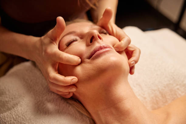 istock Mature Woman Relaxing During Face Massage in a Spa 2185763196
