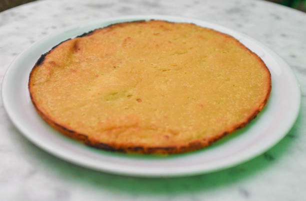 istock Faina, dish made from chickpea flour, which is similar to a savory, thick pancake or flatbread 2185763323