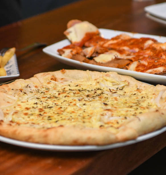 istock Snack dinner with pizzas and Argentine milanesa. 2185763359