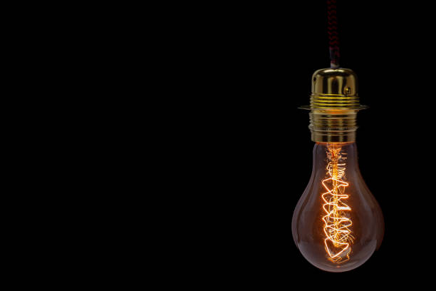 istock Vintage Edison Light Bulb with Glowing Filament Closeup 2185763964