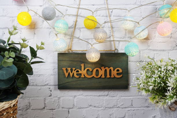 istock Welcome sign Hanging on grunge cement wall background 2185765530