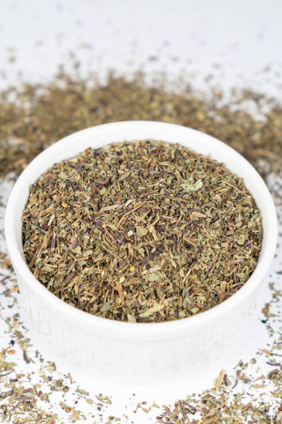 istock Seasoning dried basil in a plate, chopped basil close-up 2185766611
