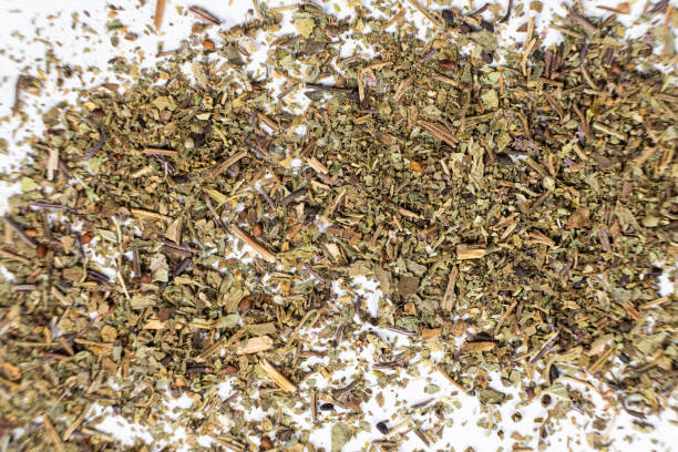istock Dry basil spice seasoning macro texture on white background. 2185766613