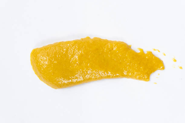 istock Smear of mustard sauce on white background isolate, creativity in cooking, macro texture 2185766683