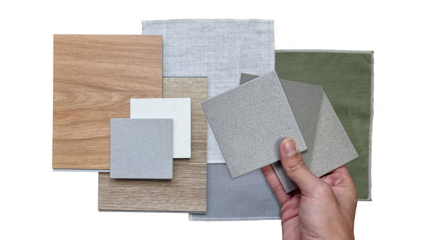 istock interior architect compare quartz stone with other material samples including curtain fabric, wooden vinyl flooring tiles, grainy artificial stone tiles isolated on background with clipping path. 2185766891