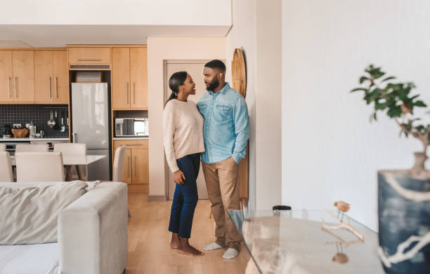 istock Affectionate young African American couple standing together at home 2185768589