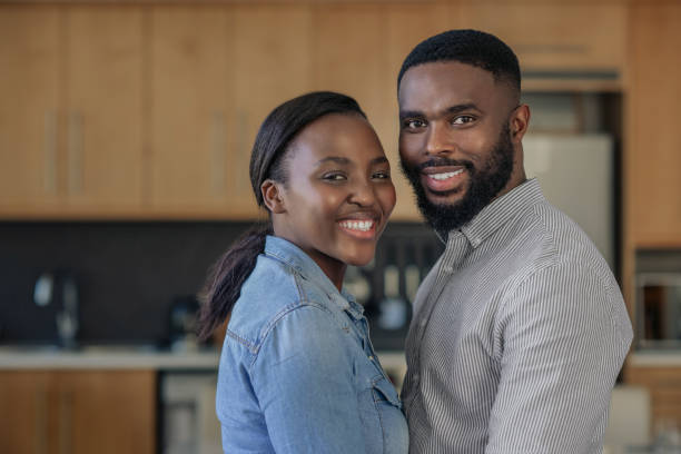 istock Affectionate young African American couple standing close together at home 2185771825