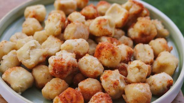 istock Fried tofu cubes sprinkled with chili powder for snacks 2185771831