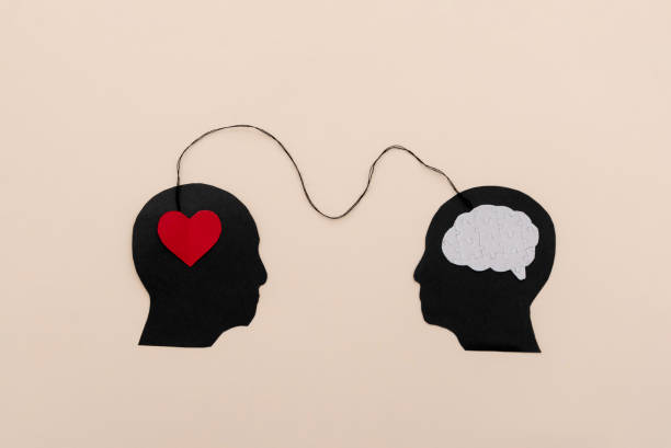 istock Silhouettes of two black human heads connected by a string symbolizing emotional intelligence and logical connection 2185772395