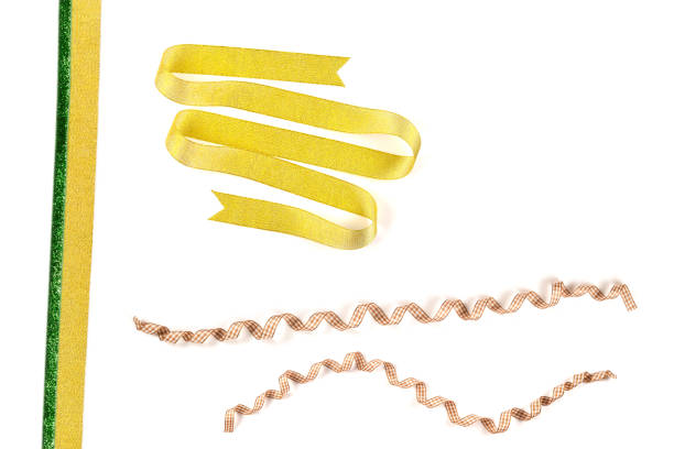 Golden and green ribbon isolated on white background.