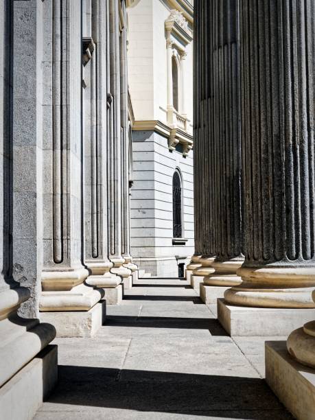 istock View of classical architectural columns with intricate details and shadows 2185773983