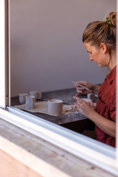 istock Female making potttery at home 2185775659