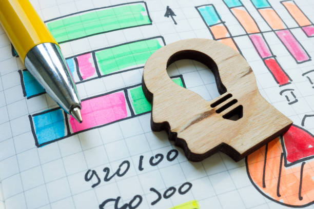 Head with a lightbulb and financial graphs. Innovation and financial strategy.