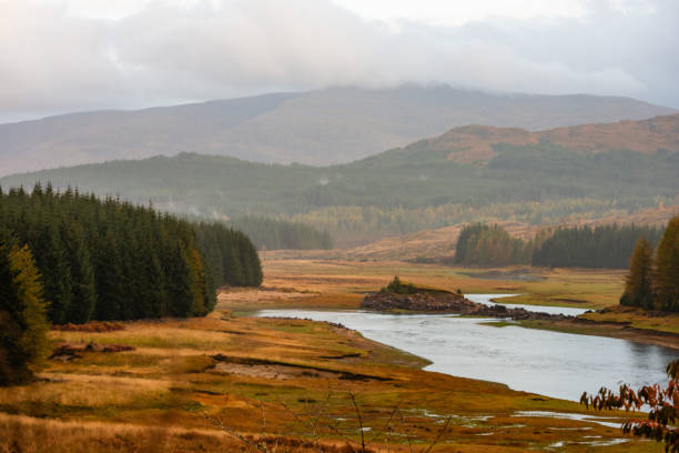 This is a scenic landscape of the Scotland Highlands with autumn leaf foliage on an overcast October day.