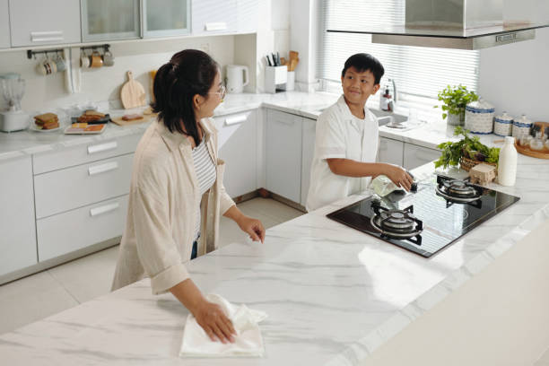 istock Cleaning Kitchen Together in Modern Home 2185777626