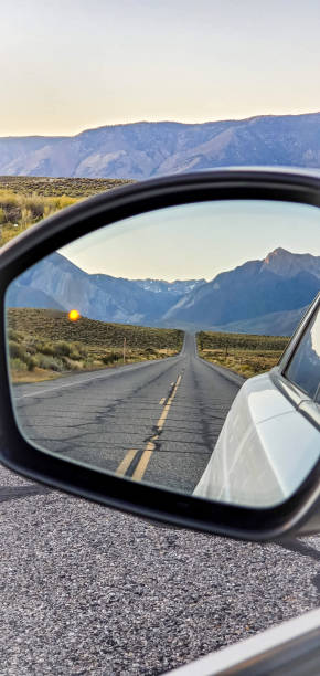 istock Beautiful long road and Mountains from car blind spot 2185778372