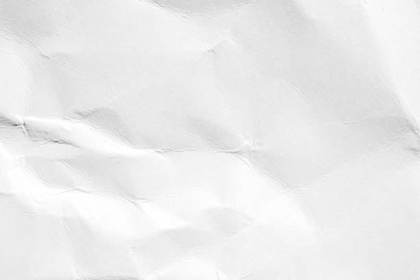 istock Crumpled white paper with subtle wrinkles creating a textured abstract background 2185778544