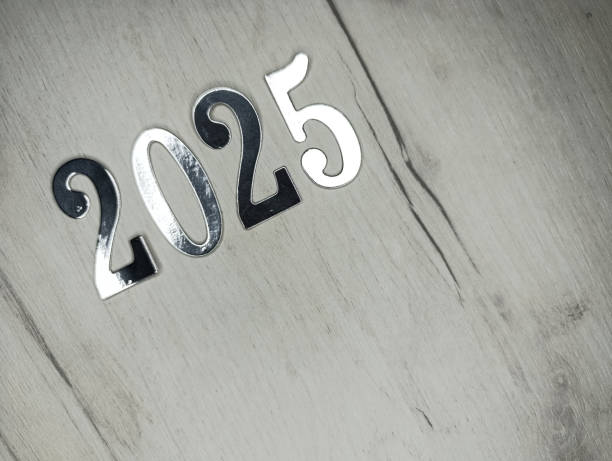 istock New year 2025 silver numbers on gray wooden background 2185779626