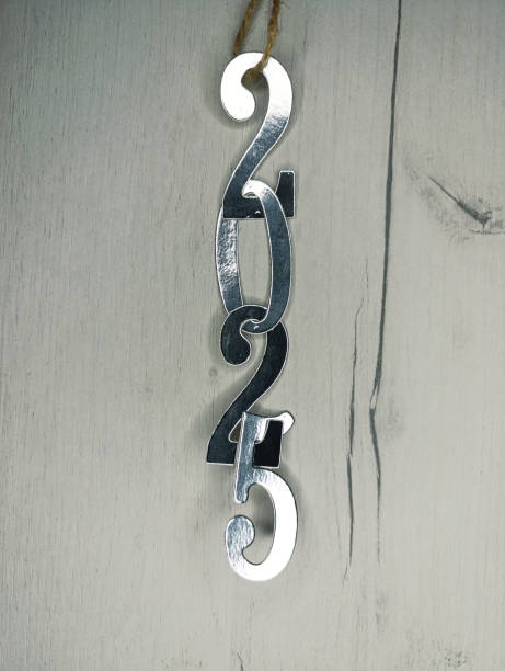 istock New year 2025 silver numbers on gray wooden background 2185779800