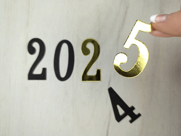 istock New year 2025 numbers on gray wooden background 2185780672