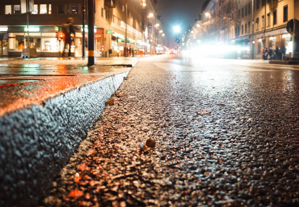 istock Close up of a wet road at night 2185783080