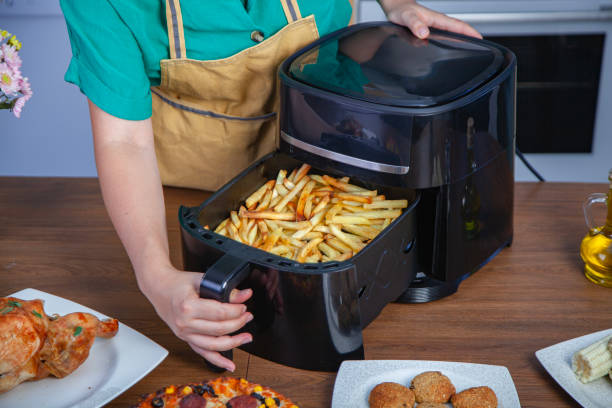 istock Preparing fried potatoes in the air fryer 2185785571