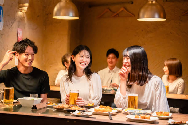 istock Young men and women drinking alcohol at a tavern 2185785808
