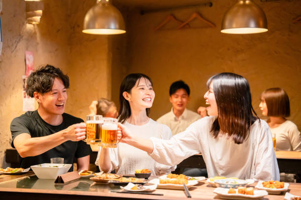 istock Young men and women drinking alcohol at a tavern 2185785837