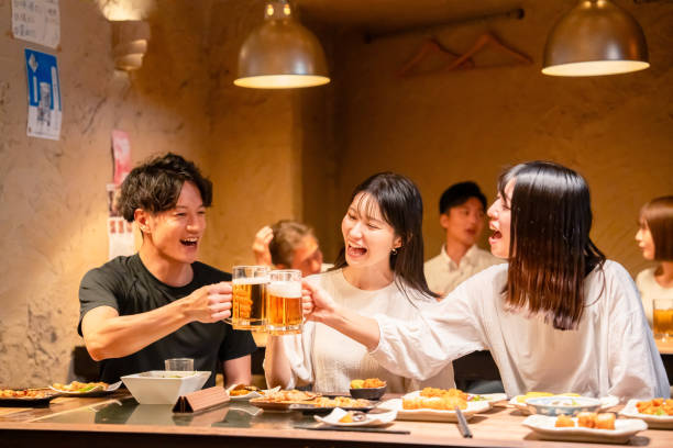 istock Young men and women drinking alcohol at a tavern 2185785838