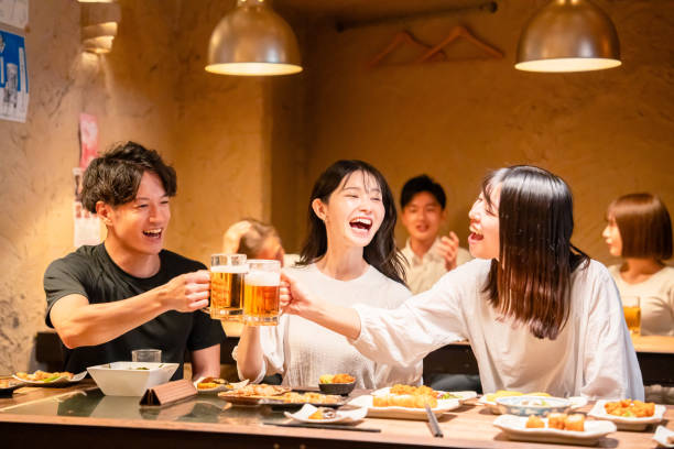istock Young men and women drinking alcohol at a tavern 2185785845