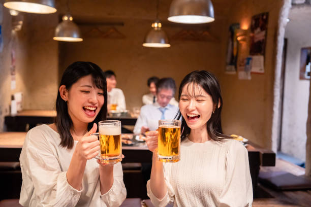 istock Two women having a girls' night out at a pub 2185786500