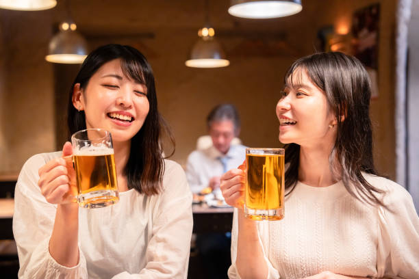istock Two women having a girls' night out at a pub 2185786520