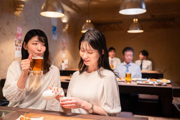 istock Two women having a girls' night out at a pub 2185786530