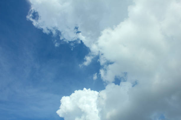 view of the blue sky mixed with large, lumpy clouds