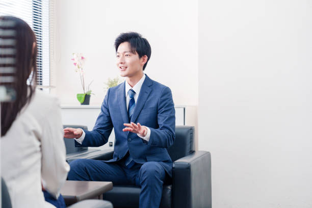 istock Salesman negotiating with clients with a smile 2185787966