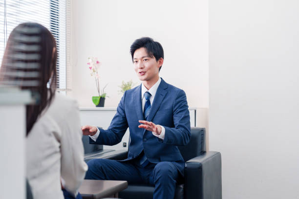 istock Salesman negotiating with clients with a smile 2185788011