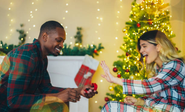 istock Man proposing to his girlfriend on Christmas Eve 2185788650